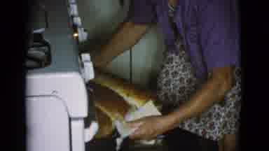 Cottonwood Arizona (1968): A Lady Bringing Out 3 Freshly Baked Loaves Of Large