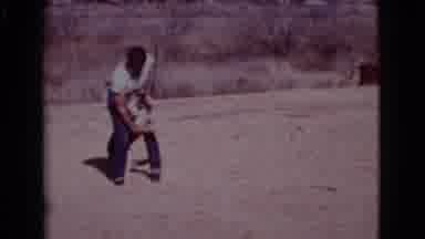 Cottonwood Arizona (1968): Man Smoking Tries To Wash His Dog Outside In A Steel