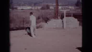 Cottonwood Arizona (1968): Man Attempting To Get A Teal Bath Towel Back From A