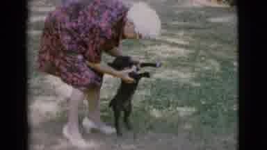 Cottonwood Arizona (1968): Woman Roughly Handles Puppy Who Turns And Sits Then