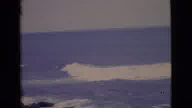 San Diego County California (1968): Large Wave From The Ocean Coming To A Rocky