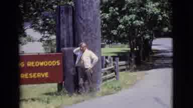 San Diego County California (1968): Man With Grey Hair Standing Next To A Sign For