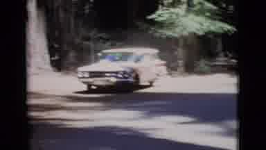 San Diego County California (1968): A Station Wagon Is Driving Into A Wooded Area