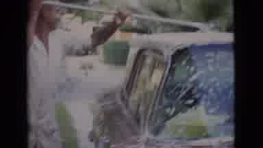 San Diego County California (1968): Man Outside Washing And Soaping Down A Car