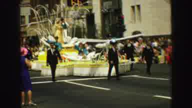 Vancouver Bc Canada (1968): People Are Walking Down The Street With A Yellow Float