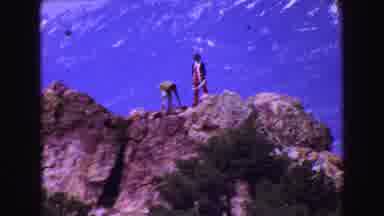 Vancouver Bc Canada (1968): People Hiking Rocky Hilltop With Mountains In