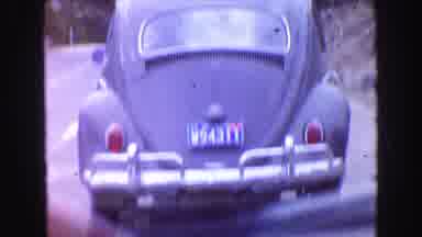 Vancouver Bc Canada (1968): A Blue Volkswagen Bug Is Driving Along In The Country