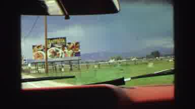 Vancouver Bc Canada (1968): Footage Shows A Car Passing A Billboard Sign For Food