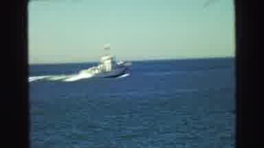 Vancouver Bc Canada (1968): Footage Of A Boat On The Water Passing Slowly Under A