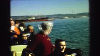 Vancouver Bc Canada (1968): People On A Boat In The Water Approaching A Large