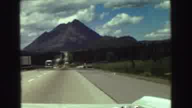 Vancouver Bc Canada (1968): Car On A Highway On A Sunny Day And Woman Playing With