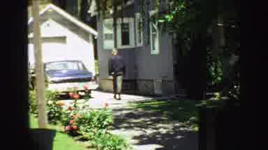 Vancouver Bc Canada (1968): A Person Walking In Their Backyard Towards The Back Of