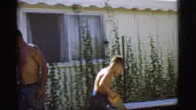 Cottonwood Arizona-1968: Boy Using Saw To Cut White Wood Outside