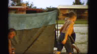 Cottonwood Arizona (1968): Three Young Men Playing Outside In The Mud With A Tent