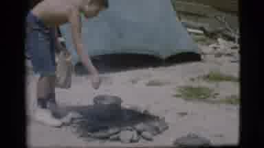 Cottonwood Arizona (1968): Two Boys Add Food To A Boiling Pot Over A Fire With A