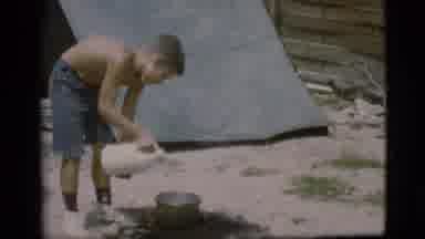 Cottonwood Arizona (1968): Boy Preparing To Cook Meat While At Camp