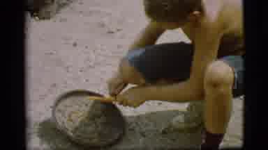 Cottonwood Arizona (1968): Boy In Shorts And Sneakers Whittles A Stick With His