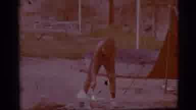 Cottonwood Arizona (1968): Little Boy Bends Down To Stir A White Mixture With A