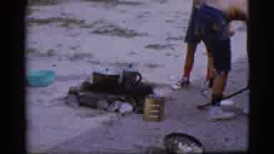 Cottonwood Arizona (1968): Two Shirtless Boys Wearing Cutoff Jeans Are Adding Wood