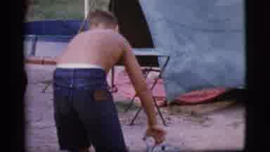 Cottonwood Arizona (1968): Shirtless Boy Handles Hot Item Outside Next To A Tent
