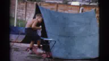 Cottonwood Arizona (1968): Young Boy Cleaning Out His Small One Person Basic Tent