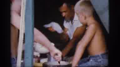 Cottonwood Arizona (1968): Adults And Kids Sitting In A Tent Sharing Food