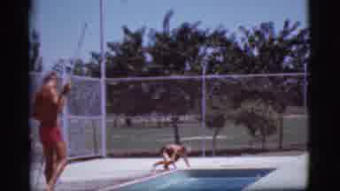 Cottonwood Arizona (1968): Child Entering In-Ground Pool And Swimming Toward Adult