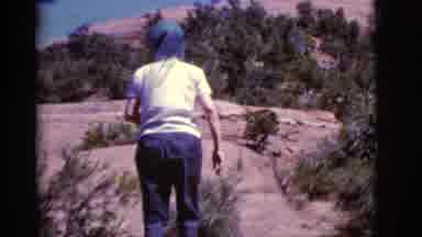 Arizona USA (1968): A Woman With A Scarf On Her Head Hiking Near Rock Formations