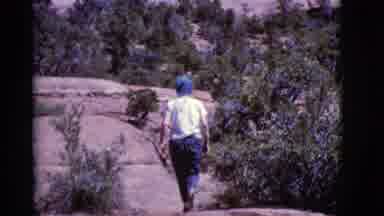 Arizona USA (1968): Person Walks On Top Of Rocky Mountain Path Where Trees Grow Up