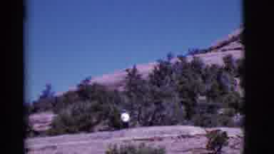 Arizona USA (1968): Person Walking Briskly Down Mountain Near Trees Rock Brush