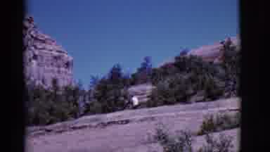 Arizona USA (1968): Person In A White Shirt Walking In Nature Among Cliffs And
