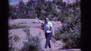 Arizona USA (1968): A Woman Wearing A Bonnet Pointing To The Mountain While