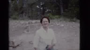 Arizona USA (1968): Woman Clothed Walking Outside Day Happy Looking Holding Alone