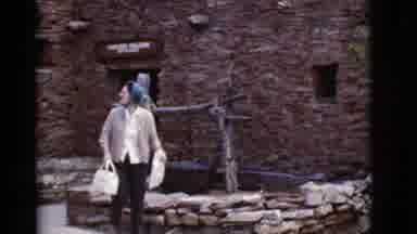 Arizona USA (1968): A Woman Is Outside A Rock-Looking Building Having Fun