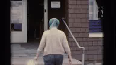 Arizona USA (1968): Lady Wearing Headscarf Climbing Stairs Inviting Camera Man