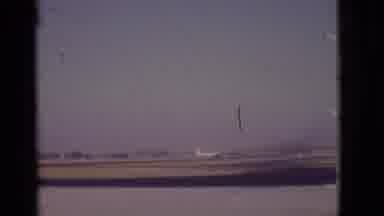 Arizona USA (1968): Airplane On Moving Down Runway Closer To Camera Larger Plane