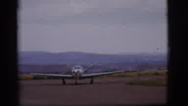 Flagstaff Arizona (1968): Plane Taxis Down The Runway Preparing To Take Off And