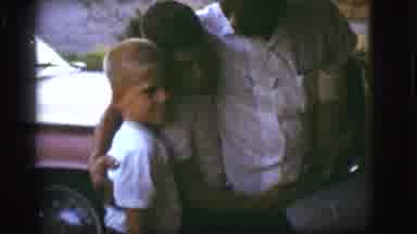 Flagstaff Arizona (1968): Father Hugging His Two Boys As He Returned Home From
