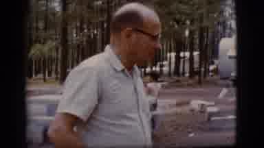 Flagstaff Arizona-1968: Two Men Talk Outside In The Forest While Camping