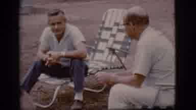 Flagstaff Arizona (1968): A Scene Of Two Men Sitting Outside In Large Chairs