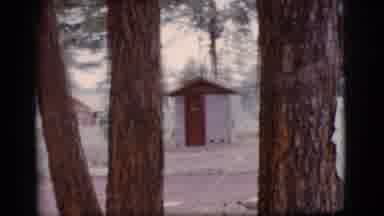 Flagstaff Arizona (1968): Person Walks Through The Woods From The Buildings And