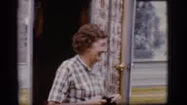 Flagstaff Arizona (1968): Woman Wearing Green Pants Walks Into Yellow Camper On A