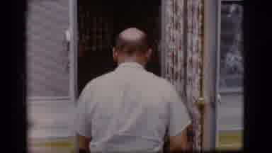 Flagstaff Arizona (1968): Old Footage Of Older Man With Balding Hair Walking Into