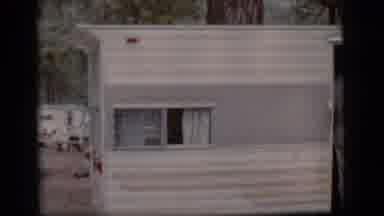 Flagstaff Arizona (1968): A Person In White Pants Stands In The Doorway Of A