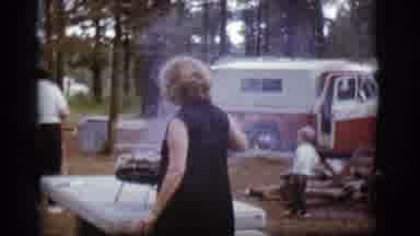 Flagstaff Arizona (1968): Woman Cooks On A Table Top Grill And Waves The Smoke