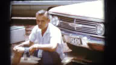 Flagstaff Arizona (1968): A Lady Cooking On The Grill Outside With A Black Dress