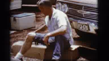 Flagstaff Arizona (1968): Old Guy With Pants Leg Raised Lifts A Glass Filled With