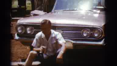 Flagstaff Arizona (1968): Man Sitting In Front Of The Car Drinking Beer From A Can