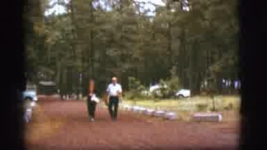 Flagstaff Arizona (1968): Couple Happily Walk Together Closely Holding Groceries