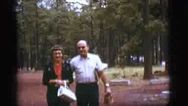 Flagstaff Arizona (1968): A Man And Woman Are Walking Down A Path Outside That Is